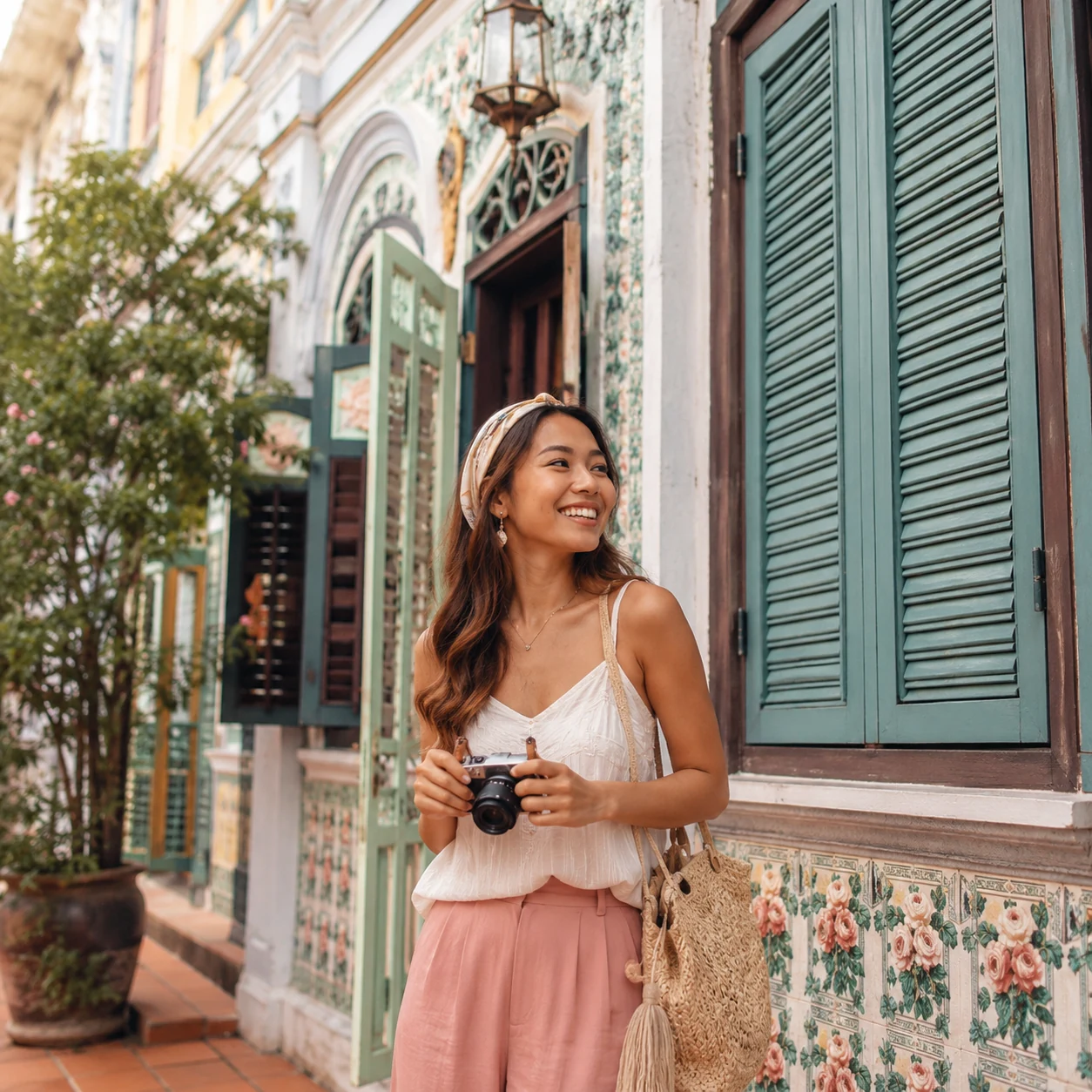 Traveler smiling after a Peranakan color walk in Penang